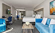 view of guest room sitting area and balcony