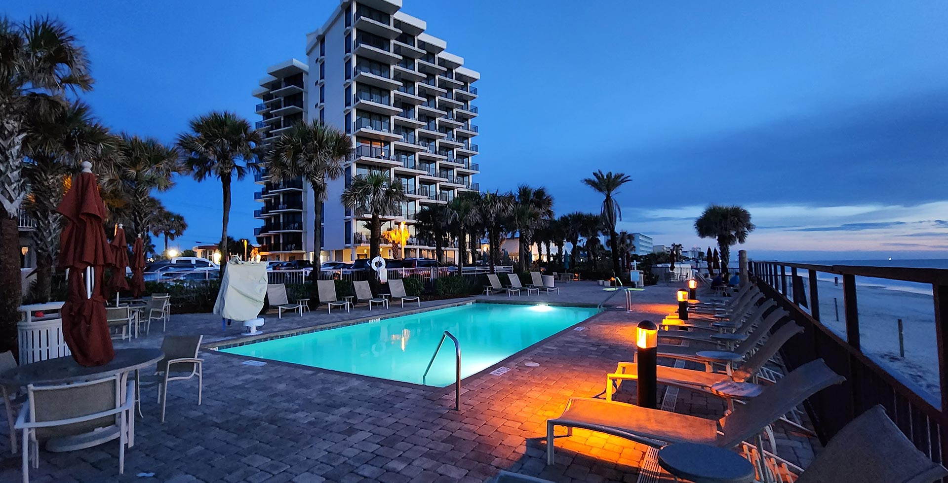 Nautilus Inn blue light beach and pool deck view